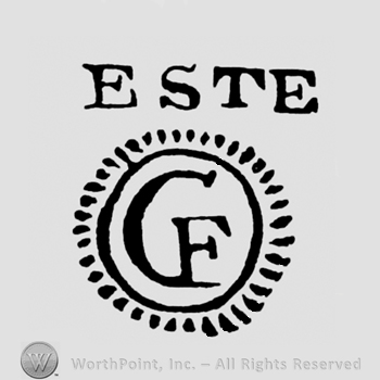 ESTE written above a serrated circle with joined letters CF