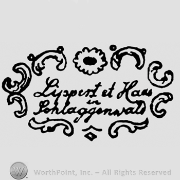 Lippert & Haas written above in Schlaggenwald inside of a frame made from branches