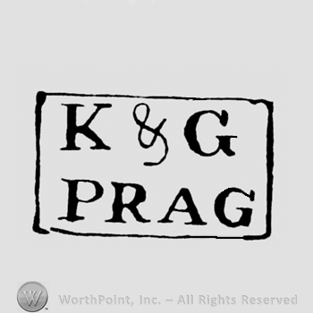 Letters K&G written above PRAG;a rectangle.