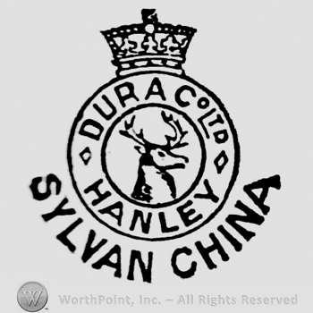 Crown above circular panel containing: a deer head in the centre, Dura Co Ltd. above, Handley below. Sylvan China bold and curved written beneath