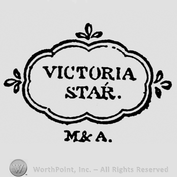 Victoria Star capital written on two rows inside frame with three fleur-de-lis above, on the left and right sides. M & A written below