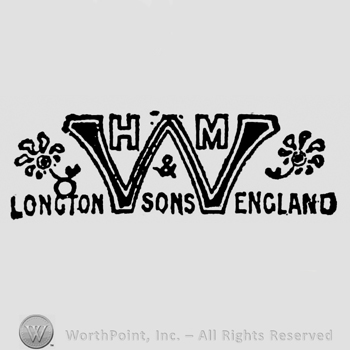 Initials H and M situated above capital initial W, flowers to the left and right. Small symbol and writing: & Sons just beneath. Longton England written below on the sides