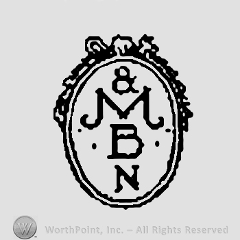 Oval Shape with a ribbon above and &MBN written in a column inside.
