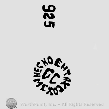 Number 925 written vertically over Hecho en Taxco Mexico written around uppercase CC