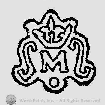 Crown above letter M above white pearl laurels left and right