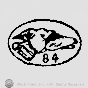 Dog half face facing right number 84 beneath all inside an oval