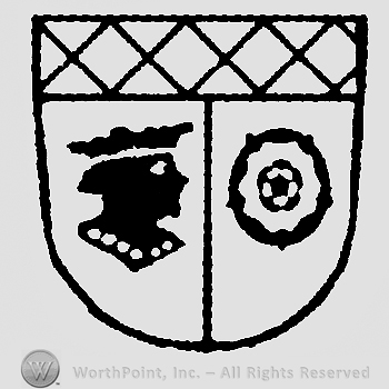 Shield with a crowned head on the left half and a circle on the right half.