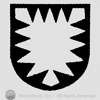 Shield with the abstract representation of a lion head.