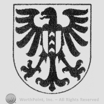 Shield with a an opened wings eagle and another little shield over.