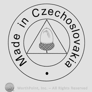 An acorn inside a triangle, all inside a double lined circle along with the text Made in Czechoslovakia written around.