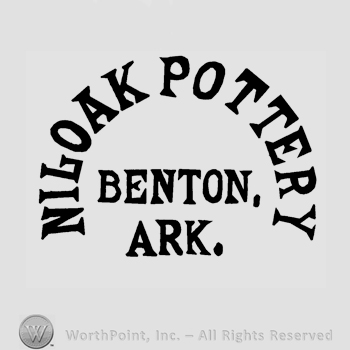 The text Niloak Pottery Benton. Ark. written in uppercase letters.