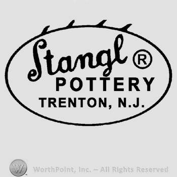 An oval with four teeth above, the text Stangl &reg; Pottery Trenton, N.J. written inside.