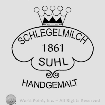 A crown over an oval design with the text Schlegelmilch 1861 Suhl written in uppercase letters, Handgemalt written below in uppercase letters.