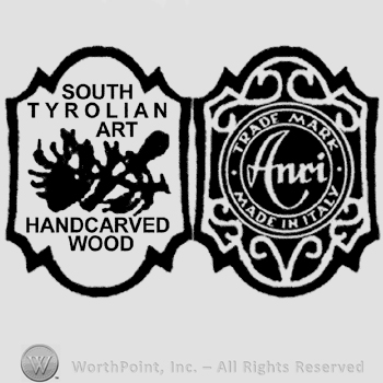 Two cartouches adjoined, the one on the left has the text South Tyrolian Art Handcarved Wood written in uppercase along with a design in the center and the one on the right has a circle with Anri handwritten in it and the words Trade Mark Made in Italy written around in uppercase letters.
