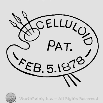 A painter's palette with three brushed, the text Celluloid Pat. Feb. 5. 1878 written on it in uppercase letters.