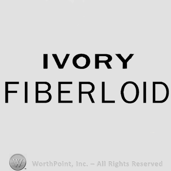 The words Ivory Fiberloid written on two rows, in uppercase letters.