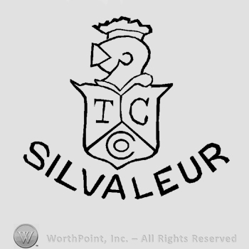 A knight's helmet on a shield with letters T, C and Co. written inside, the word Silvaleur written below in uppercase letters.