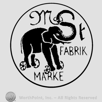An elephant on wheels, the text M S T Fabrik Marke, all inside a circle.