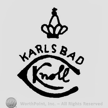 A crown above the word Karlsbad and a C with the word Knoll written inside