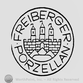 A circle with a castle inside and the text Freiberger Porzellan