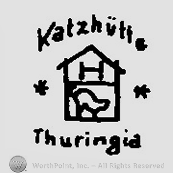 A house with a cat and an uppercase H inside surrounded by the text Katzhutte Thuringia and two stars
