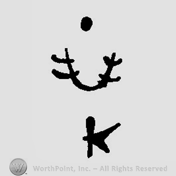 Two deer horns above the letter K in uppercase under a dot