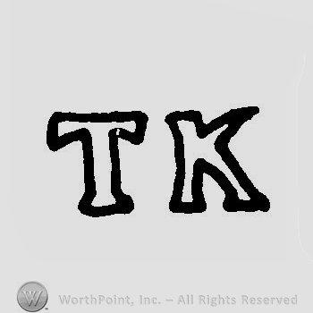 Letters TK in uppercase.
