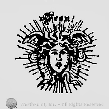 Medusa's face surrounded by rays and the word Jean written above in gothic letters