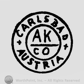 A circle with the text Carlsbad Austria A K Co inside