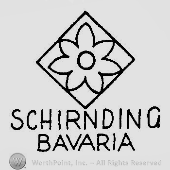 A diamond with a flower inside and the text Schirnding Bavaria