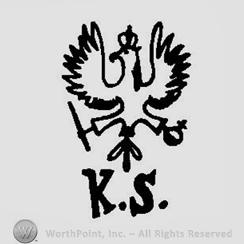 A crowned eagle with spread wings holding a scepter and a cross above the initials K. S.