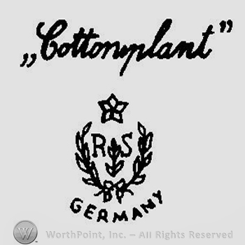 A star above the letters R S surrounded by two branches with leaves and the wordv Cottonplant handwritten above
