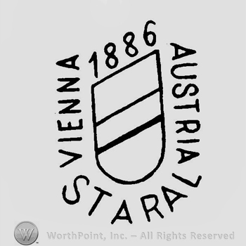 A shield surrounded by the text 1886 Staral Vienna Austria
