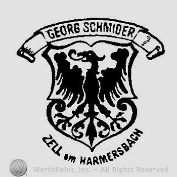 A shield with a legendary bird under a banner with Georg Schmider and above the text Zell am Hammersbach