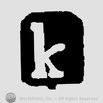 Letter K over a black shape.