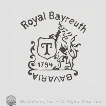 Lion standing and holding a shield with the letter T on it and ROYAL BAYREUTH 1794 BAVARIA