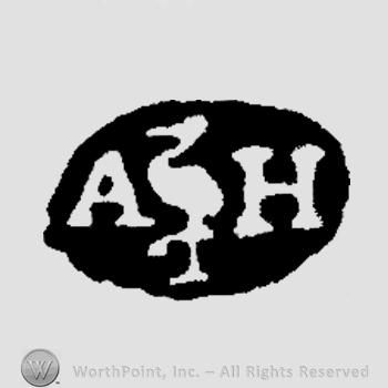 An ovel with a stork and the initials A H inside