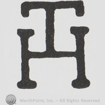 the initials TH combined with the T above