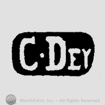 The text C Dey inside an oval