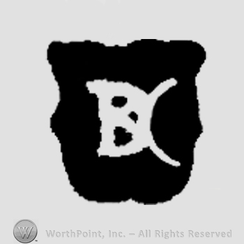 The initials B D C on a shield combined