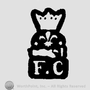 A crown above a fleur de lis and the letters F C in uppercase