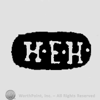 The initials K E H inside an oval