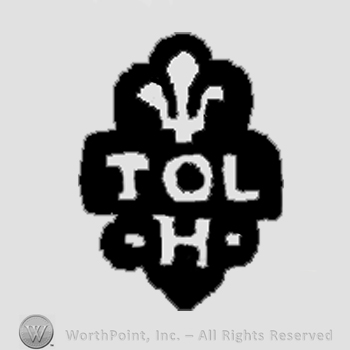 TOL in the middle;H below; fleur-de-lis symbol on top.
