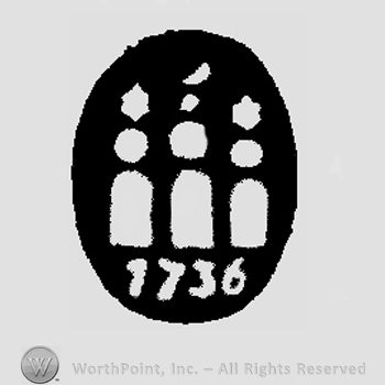 Three towers insid an oval with number 1736 below and a crescent on top.