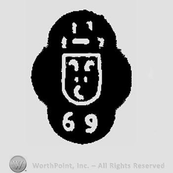 69 written on the bottom;symbol with three crecents and two dots inside in the middle.