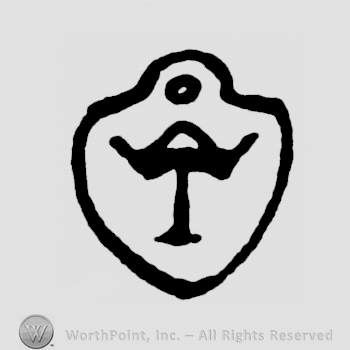 An uppercase T on a shield