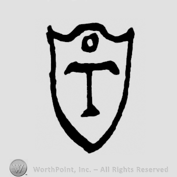 An uppercase T on a shield