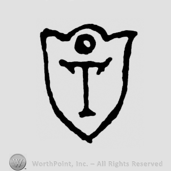 A shield with a circle and an uppercase T