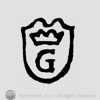 A shied with a crown and a G