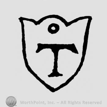 A shield with an uppercase T